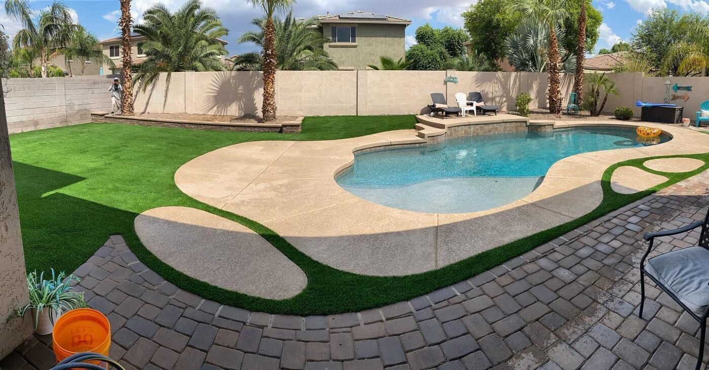 synthetic turf installed a paved pool deck in a Palm Valley residence
