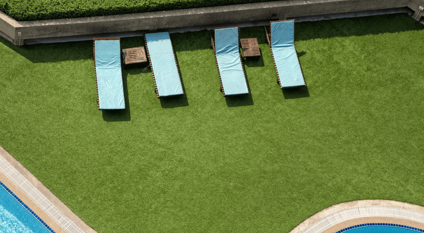 a pair of slippers on a plush and realistic playground turf installed by our team